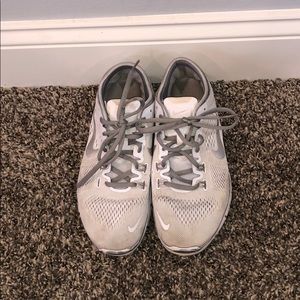 white nike running sneakers